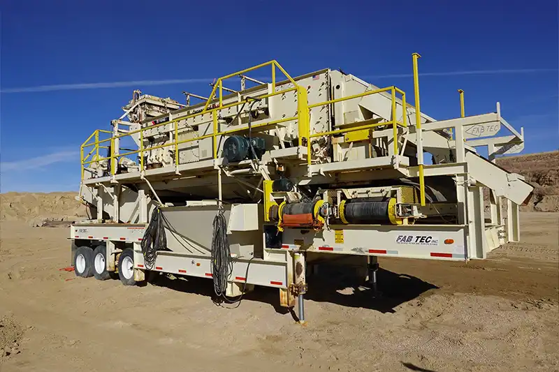 Portable aggregate screening plant on trailer chassis at a mining site
