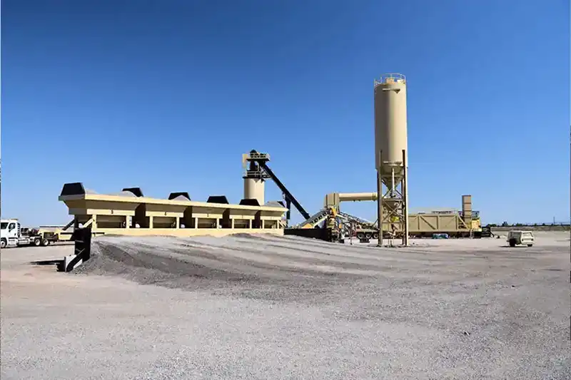 Portable asphalt mixing plant with aggregate bins, conveyors, and storage silo